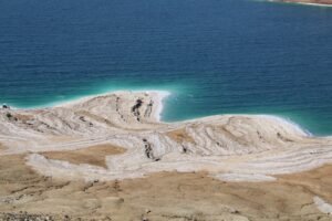 Aerial view of the Dead Sea's salt formations and blue waters